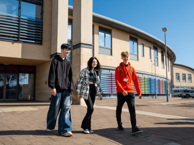 Three students walking outside Bridlington campus.